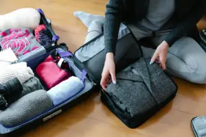 packing cubes, Photo by Timur Weber: https://www.pexels.com/photo/a-person-packing-up-things-9185878/, How to Clean Your Packing Cubes Quick Guide